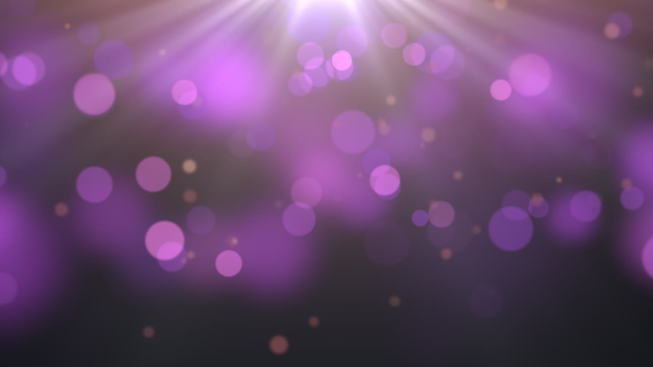 movimiento y mosca partículas púrpuras con bokeh redondo sobre fondo oscuro