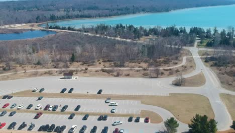 drone shot of parking lot at sleeping bear sand dunes national lakeshore in michigan