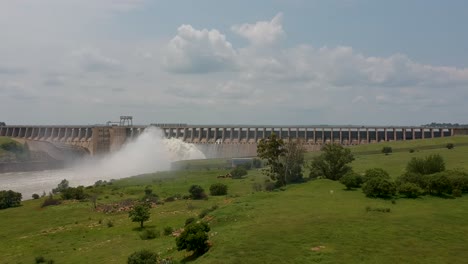 dam wall with sluice gates open 4k 30fps