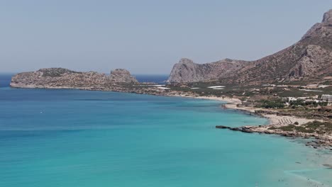 Majestic-Falasarna-beach-with-mountain-background-in-Crete-island,-aerial-drone-view