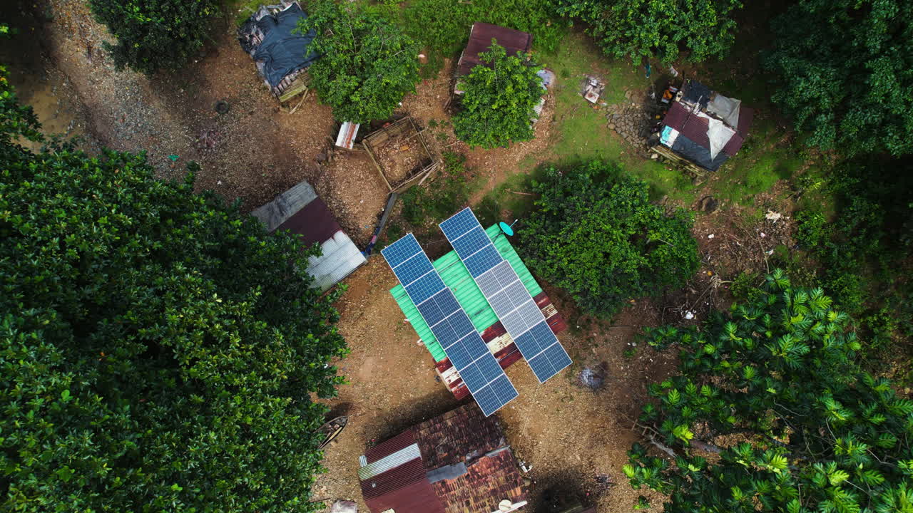 Birds eye aerial view above solar powered building in a town, Sao Tome, Africa