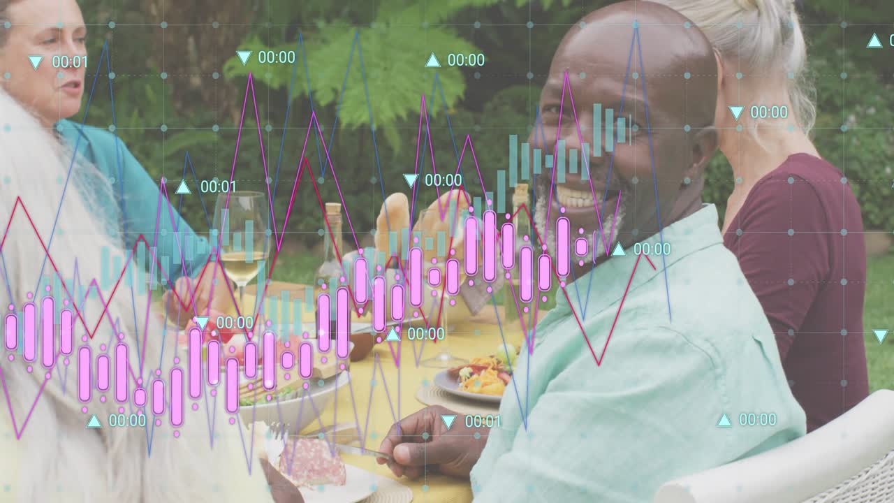 Silver haired man tasting meat and sipping wine with finance charts showing market trends at dinner