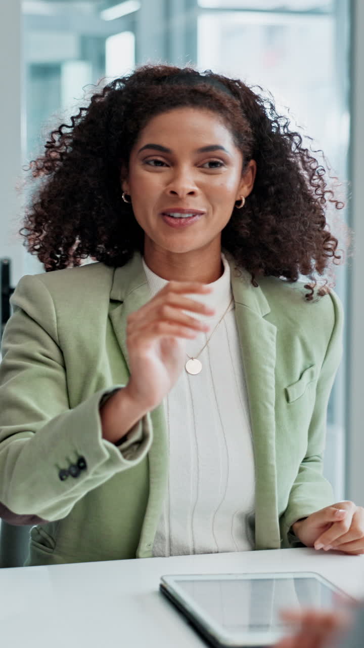 A woman in a business meeting celebrates success