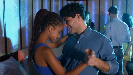 romantic couple dancing on the floor