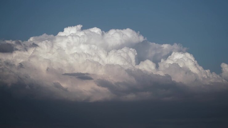 Time Lapse of Large White Cumulus Clouds Moving Across Blue Sky