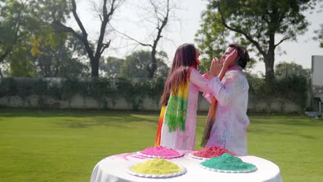 Indian-couple-getting-romantic-at-a-Holi-party