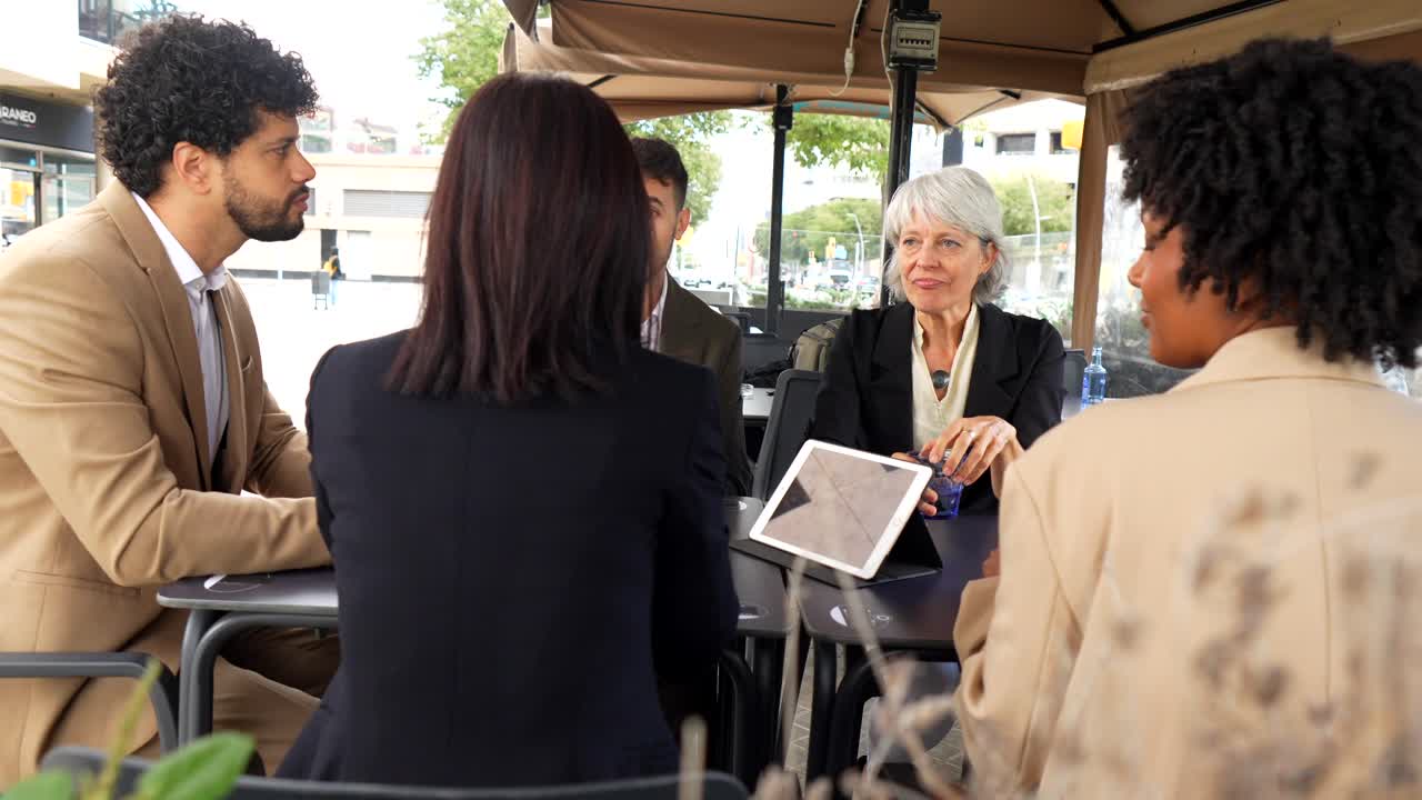 Group of business professionals meeting outdoors