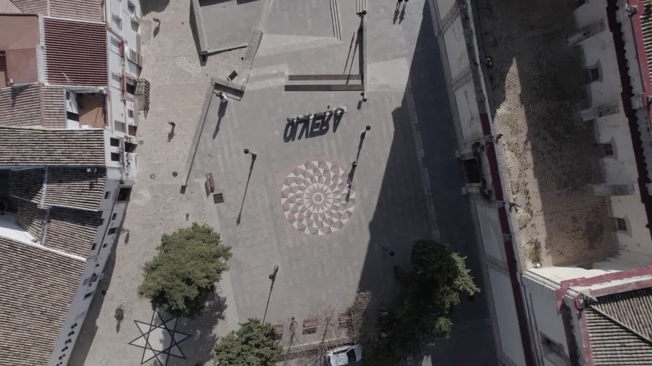 "Drone footage with an ascending overhead shot of the plaza by Olvera Cathedral, Spain. Captures the historic square, iconic architecture, and Andalusian charm from a unique perspective."