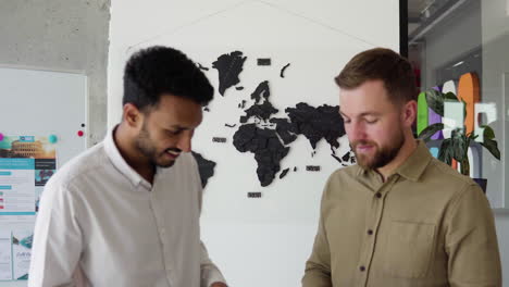 happy men at the travel agency