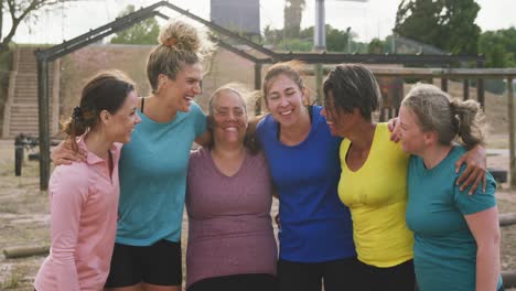 Female-friends-enjoying-exercising-at-boot-camp-together