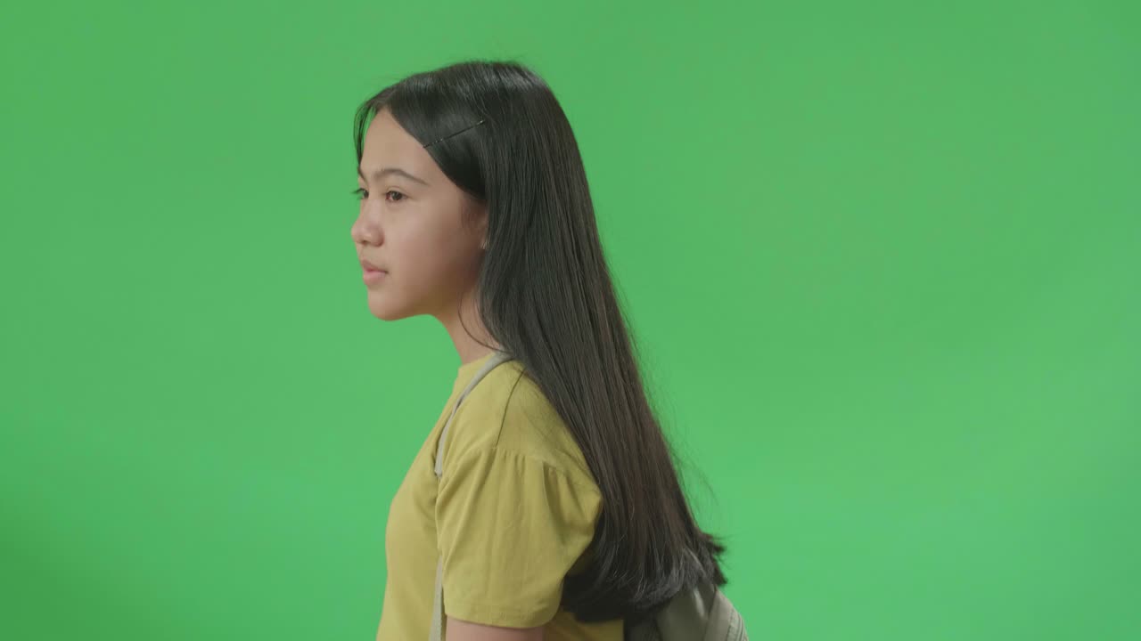 Girl Walking with Backpack on Green Screen