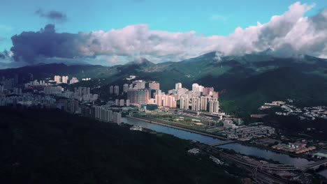 Aerial-dolly-over-Ma-On-Shan-river-town-of-Hong-Kong-on-a-cloudy-day