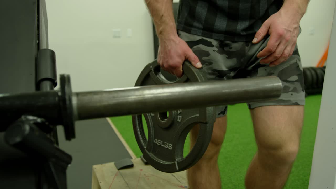 Muscular bodybuilder handsome men doing exercises in gym