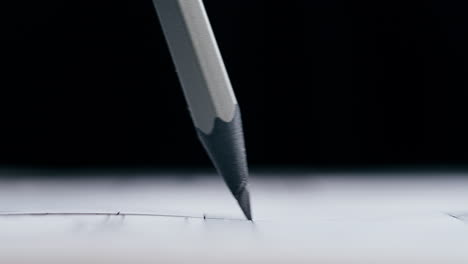 pencil drawing a line on paper
