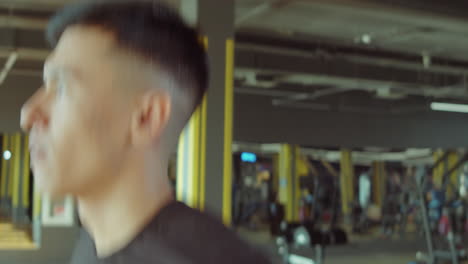 Young-Man-Having-Treadmill-Workout-in-Gym