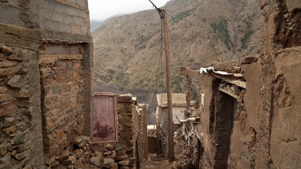 The mountain village’s narrow streets are filled with the sounds of children playing and market vendors, while Toubkal’s snow-covered peaks loom above the rooftops