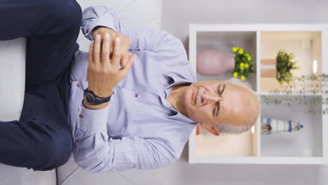 Vertical-video-of-The-grieving-old-man.-Unhappy-and-full-of-trouble.