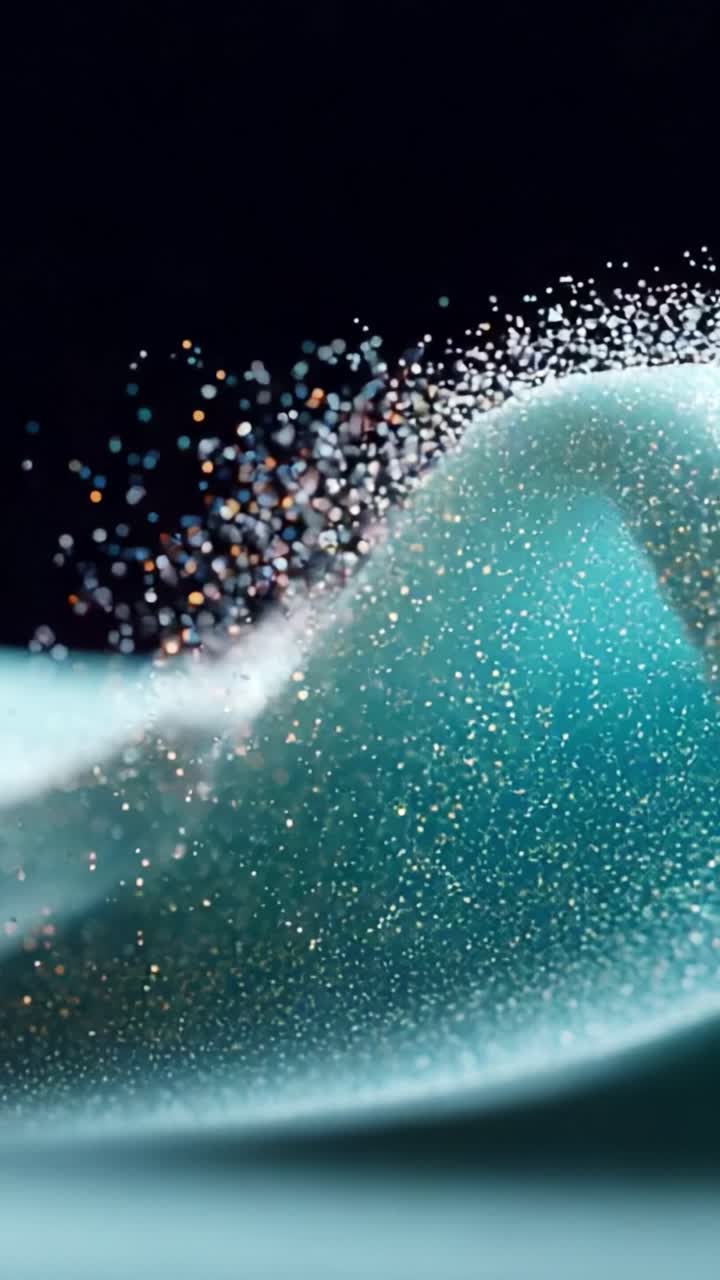 A mesmerizing display of sparkling water droplets dancing through the air, creating an ethereal effect against a backdrop of deep blue that highlights the beauty of liquid motion and shimmering light