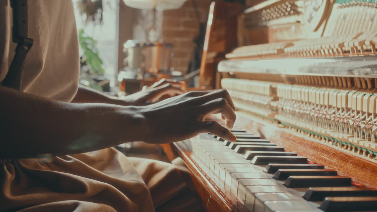 A Man Playing an Antique Piano