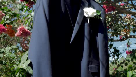 Groom-Suit-Hanging-On-colorful-flower-tree