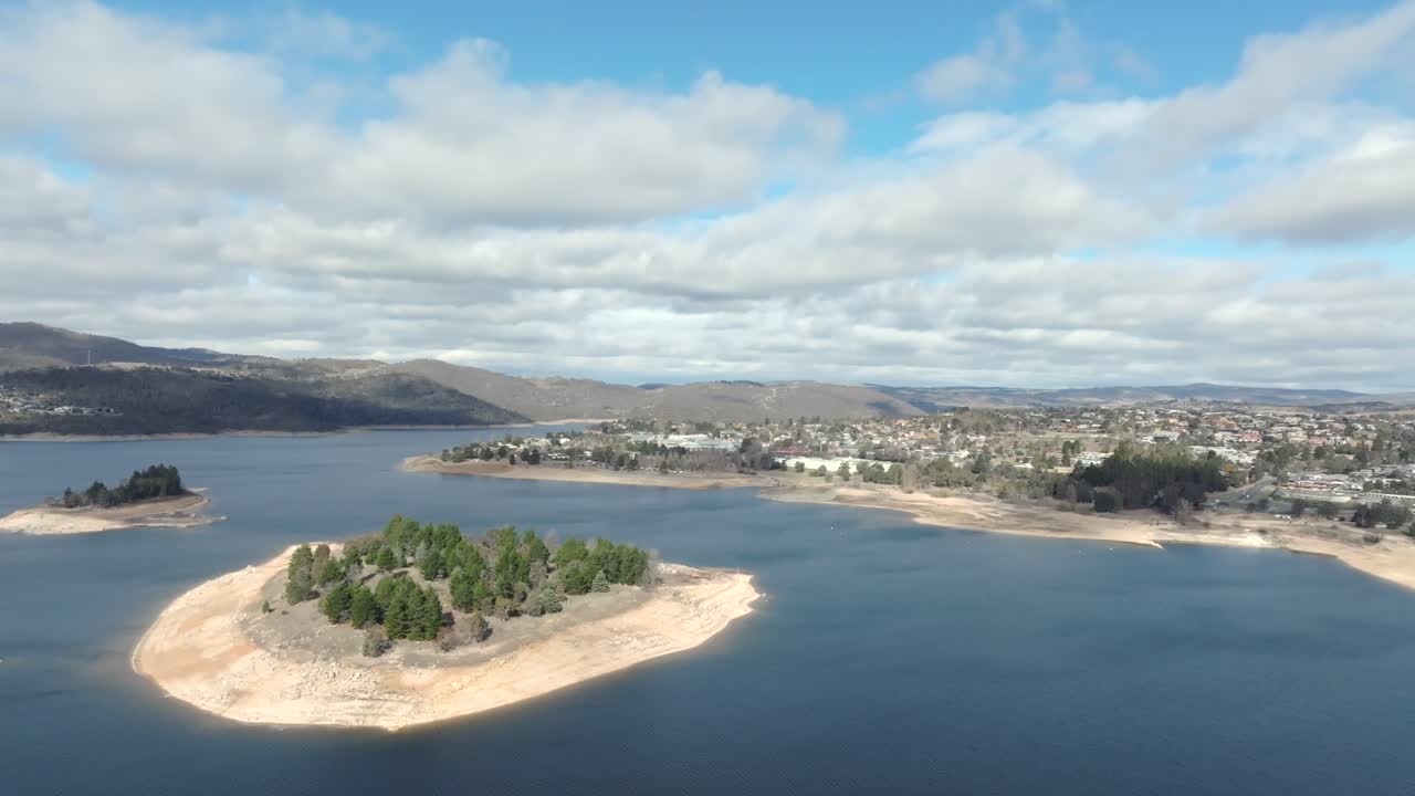 Slow moving drone shot over Lake Jindabyne and the town, NSW, Australia