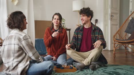 friends enjoying tea and conversation in a cozy apartment