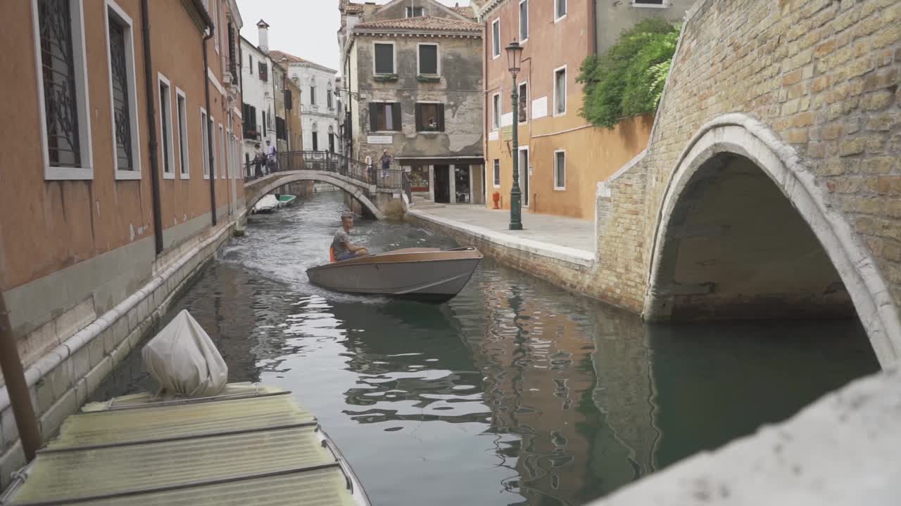 Speed boat sailing on a Venice canal