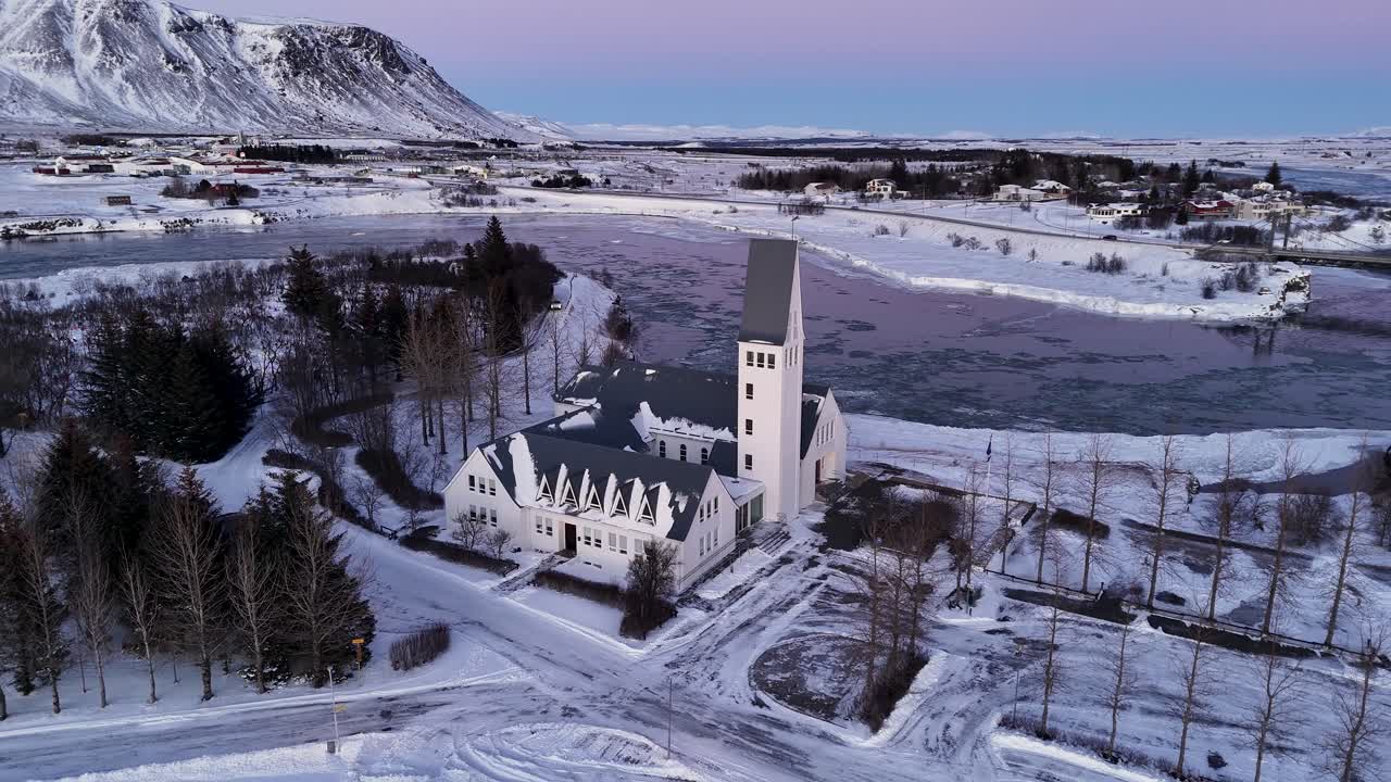 Imposing Architecture Of Lutheran Church During Winter In Selfoss, South Iceland. Aerial Drone Shot