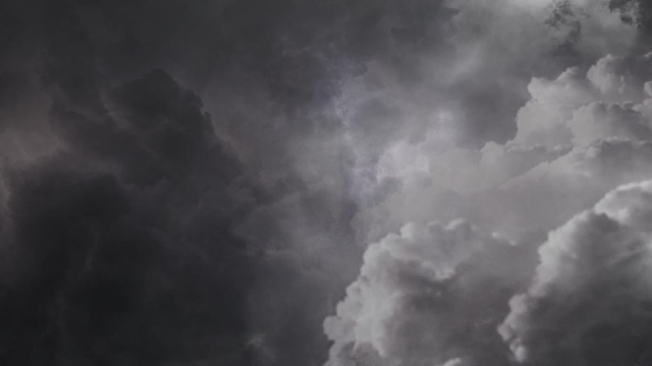 4k view of dark clouds and thunderstorm in the dark sky