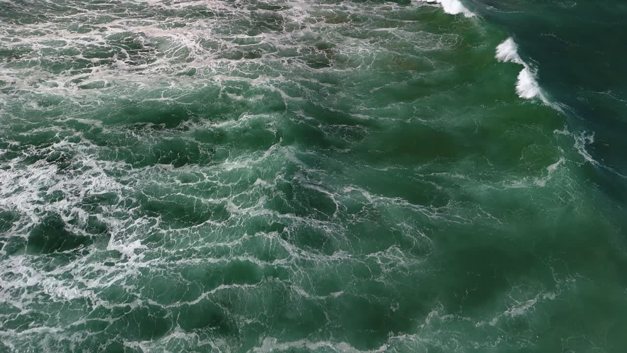 Aerial View of Ocean Waves Crashing