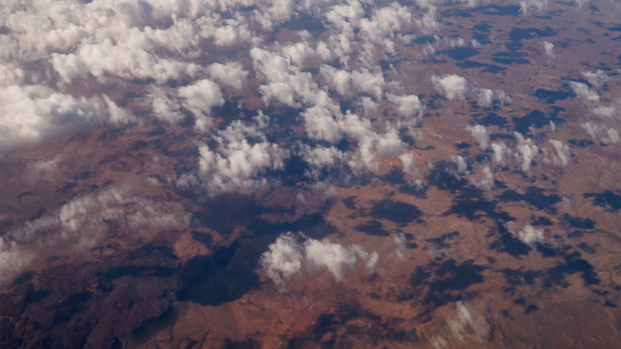 Aerial view of desert landscape with clouds