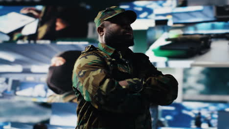Black male veteran reviewing satellite data in a control center