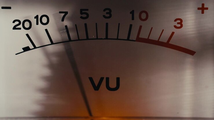 Macro of Vintage Analog VU Meter Needle Moving on Scale