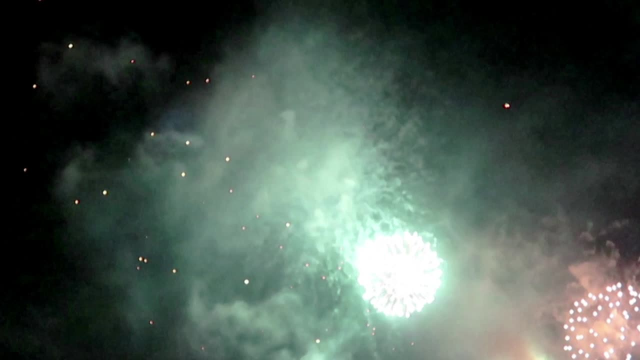 holiday n vacation concept - colorful firework n lantern on black night sky scene