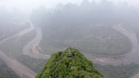 yangshuo damian mountain lookout, karst mountain landscape, 4k aerial misty view