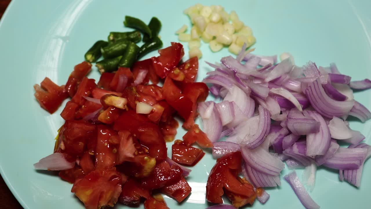 chopped kitchen vegetables in ceramic plate at indoor
