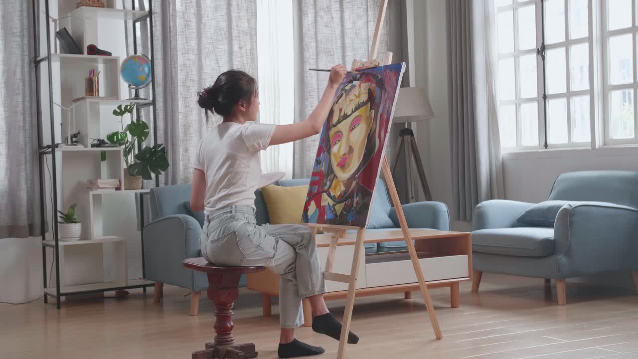 Talented Female Artist Energetically, Enthusiastically Using Paint Brush She Creates Modern Masterpiece Of The Oil Painting. Creative Studio With Canvas