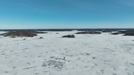 drone video over a frozen lake on a sunny day