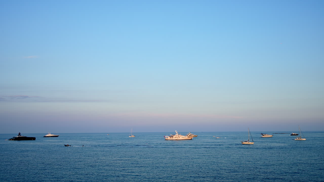Multiple boats moving on the sea in daylight in Antibes, France