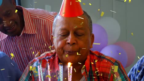 Senior-friends-celebrating-a-birthday-indoors