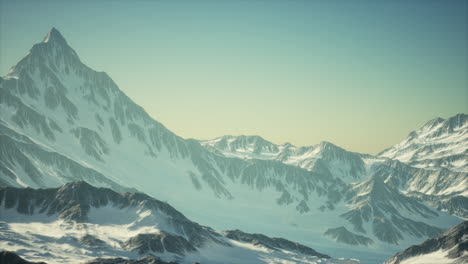 Scenic-view-on-snowy-Matterhorn-peak-in-sunny-day-with-blue-sky