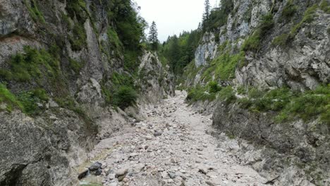 drone view of dry river bed strewn with rocks almach gorge bavarian alps germany