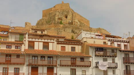 historic center with view of castle ruins in morella, spain - wide