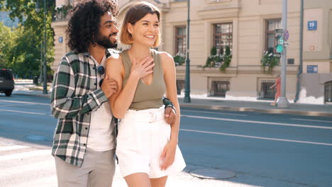 couple walking down a city street
