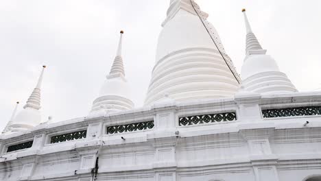 white pagoda with multiple spires in bangkok