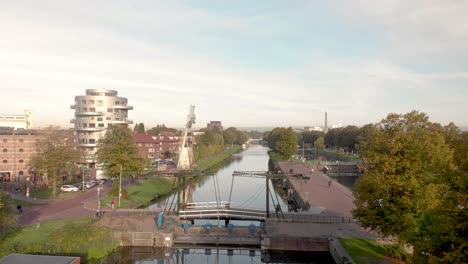 former industrial area and transportation canal in the city of utrecht now reformed into a green neighbourhood with floating houses, recreational areas and bike path