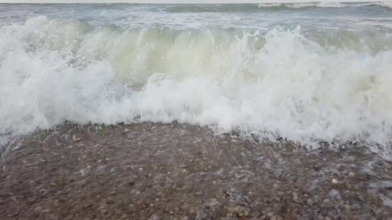 Sea wave on the beach in summer.