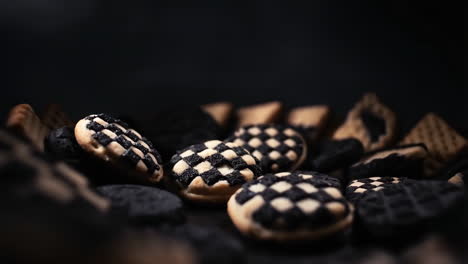checkerboard cookies on a dark background