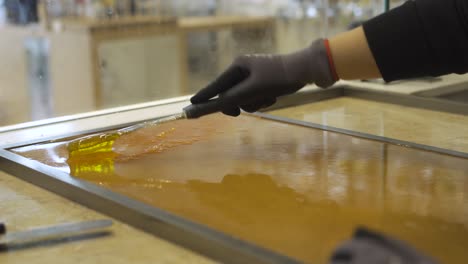 stirring hot thick liquid caramel  before making candy