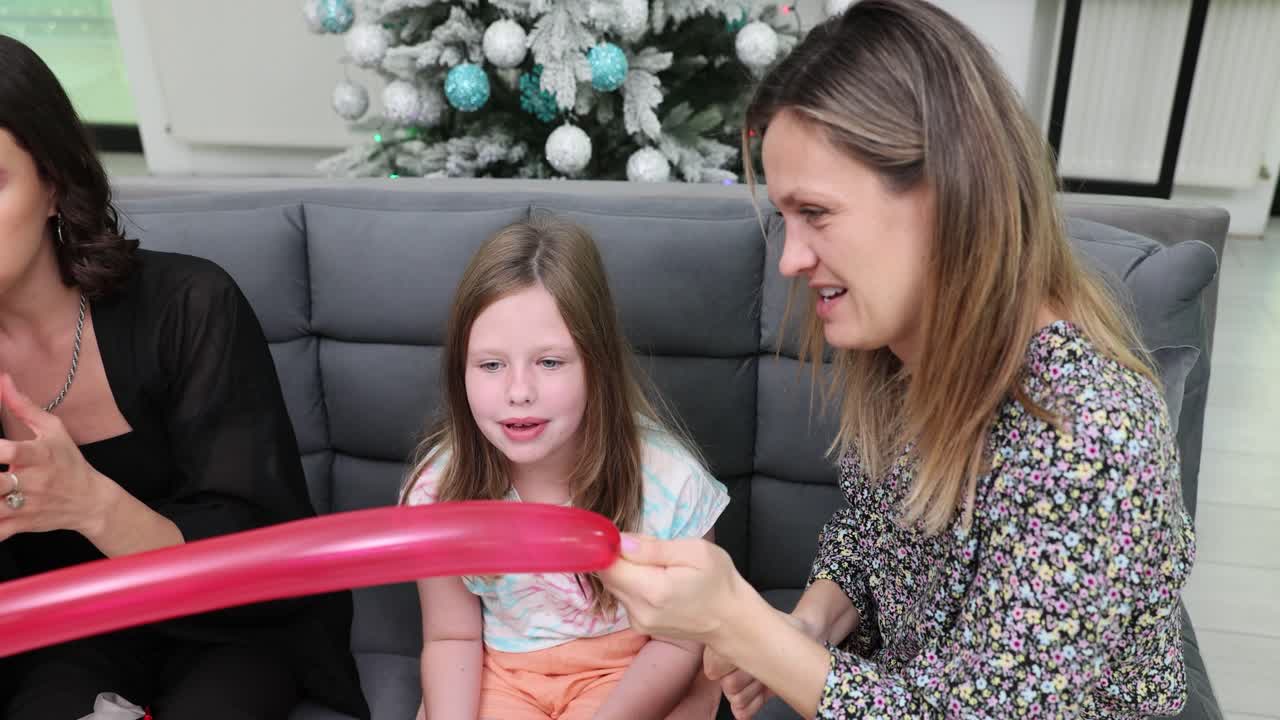 Family inflating balloons